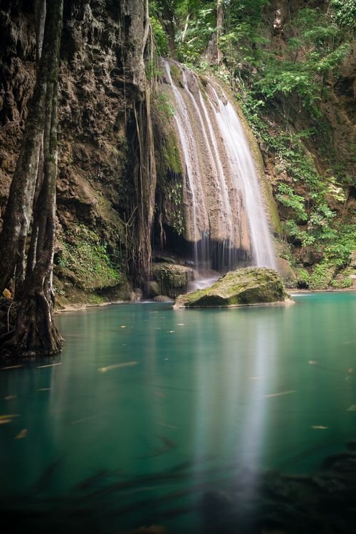 Large waterfall at third tier of Erawan Falls in Kanchanaburi Thailand